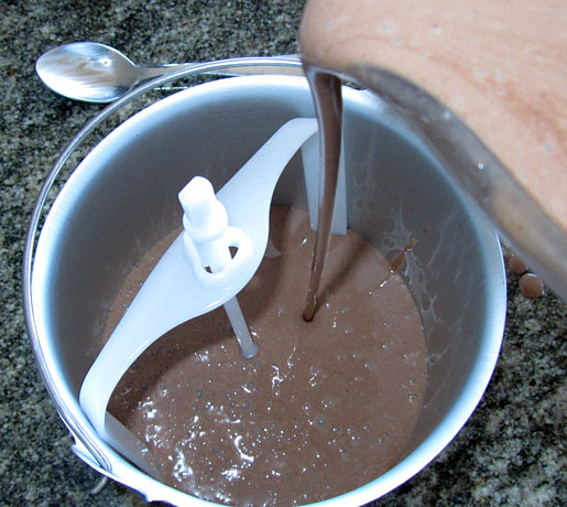 adding mixture to the ice cream machine