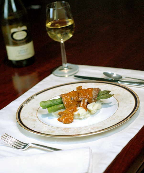 veal scallopini with asparagus, served over garlic mashed potatoes