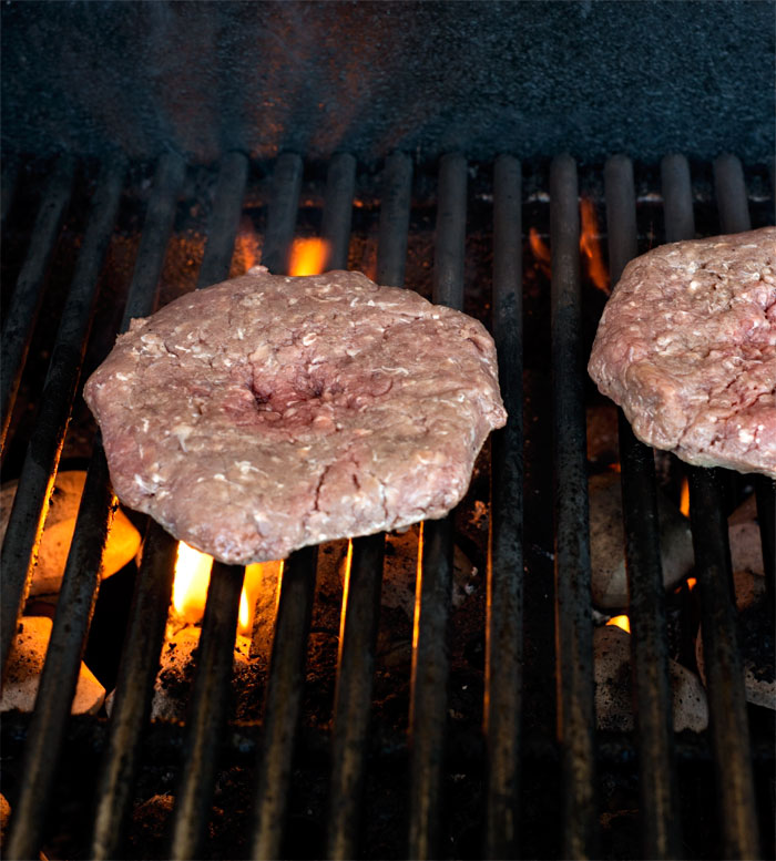 beef patty on the grill